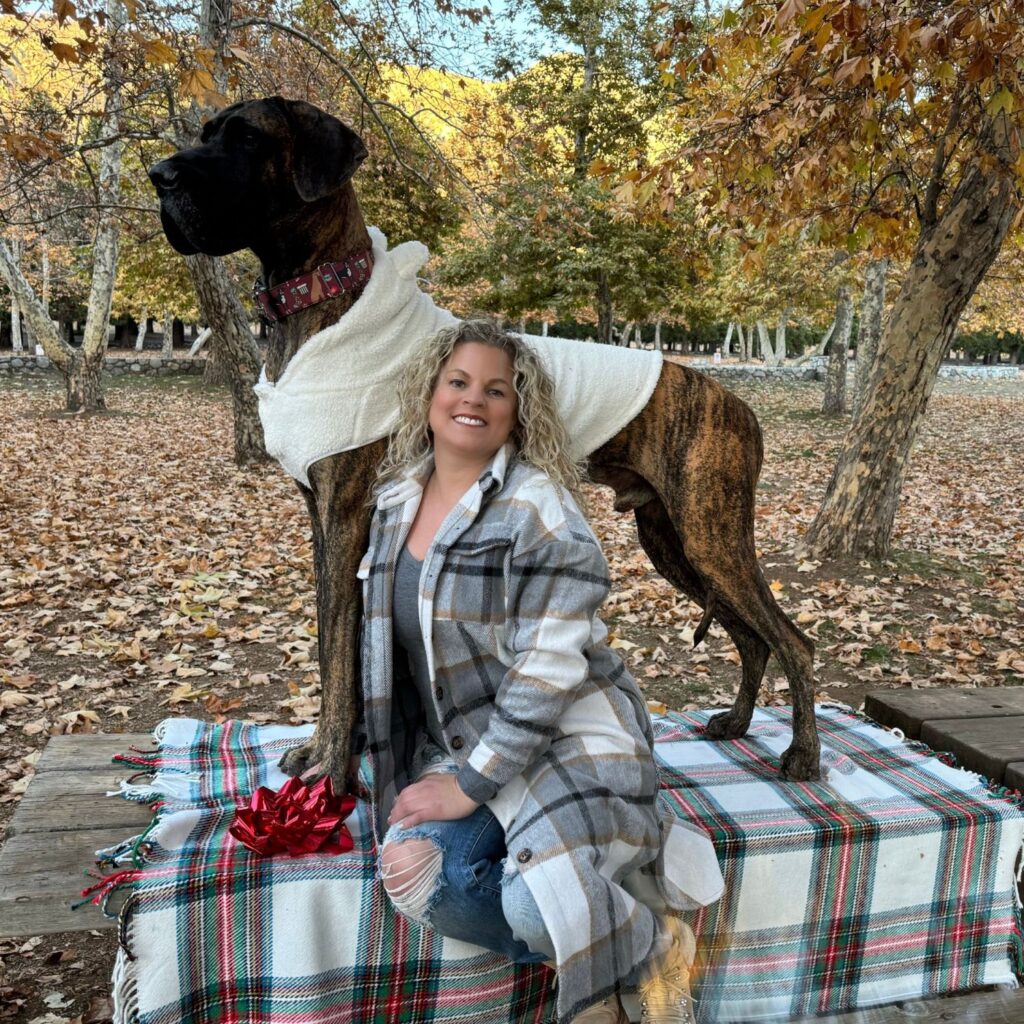 Keri Prather, LMFT, outdoors with her Great Dane therapy dog, Anders, offering counseling services in Fullerton, CA.
